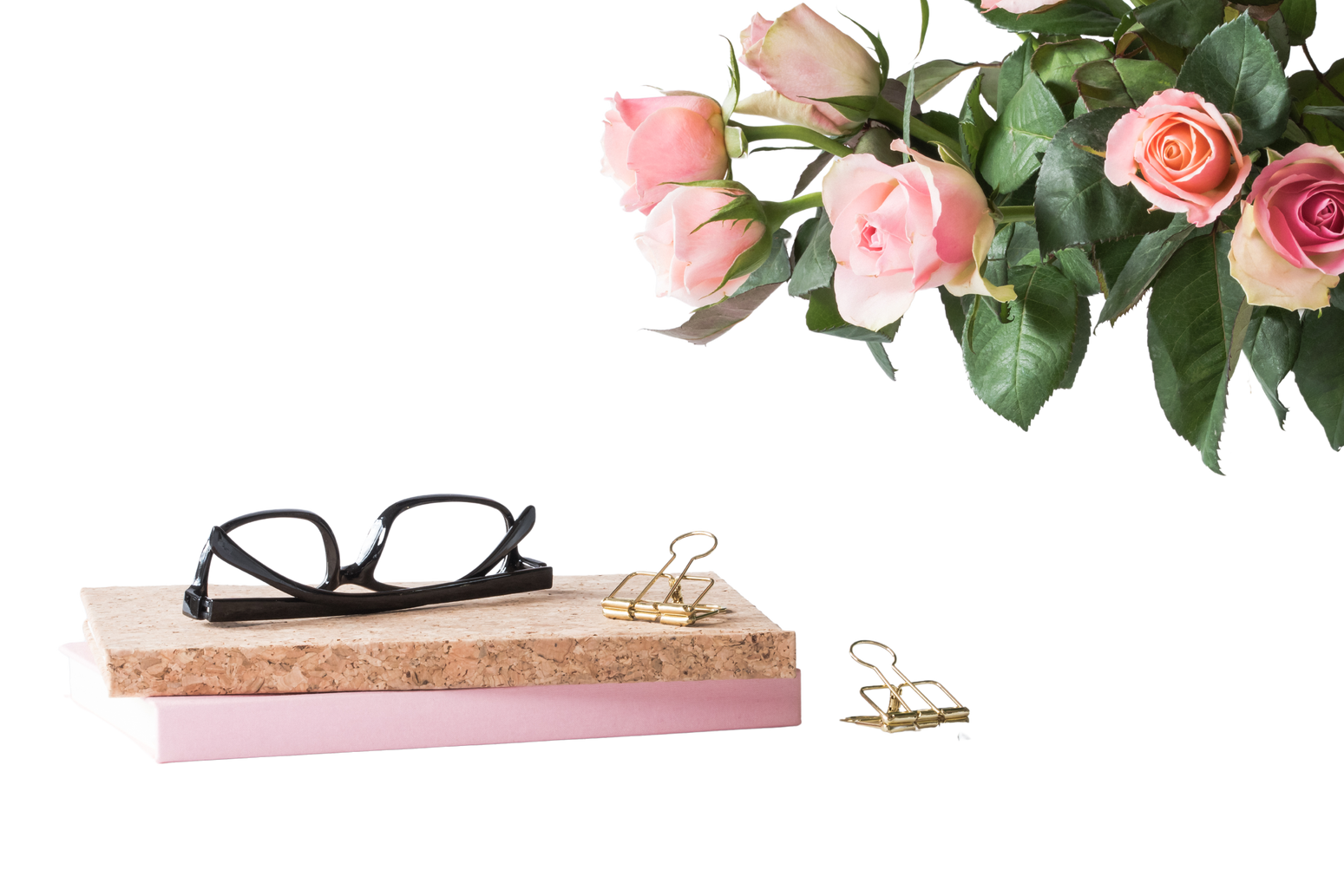 Eyeglasses on Book Beside Rose and Keyboard