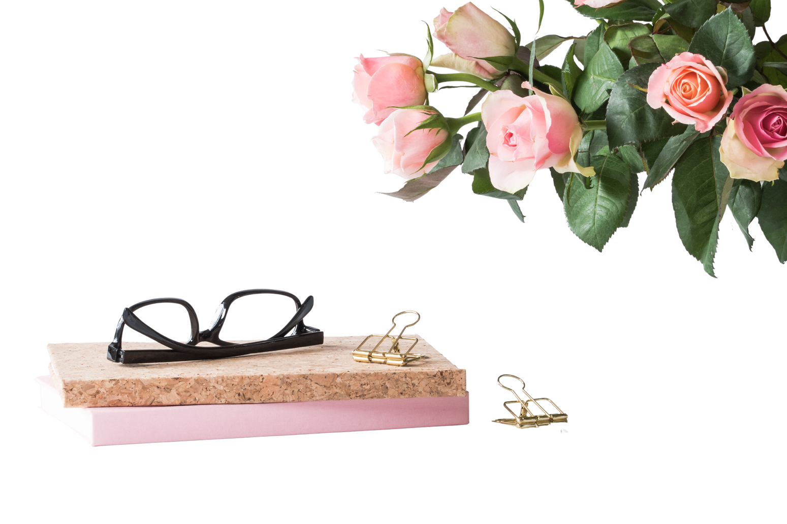 Eyeglasses on Book Beside Rose and Keyboard